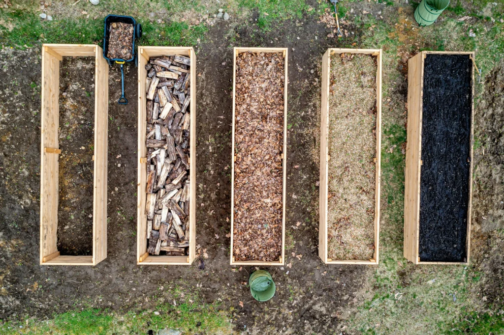 Raised garden bed material options including cedar boards, galvanized metal, and composite boards